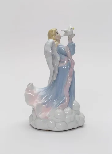 Vista 5 de Cosmos Gifts 1334 - Figura inspiradora de porcelana fina con diseño de ángel de la paz sosteniendo paloma, caja de música