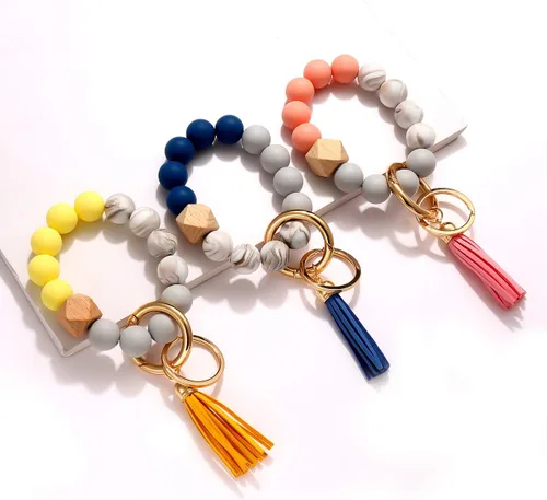 Vista 4 de 4 llaveros de silicona para mujer, pulsera elástica, llavero para casa y automóvil