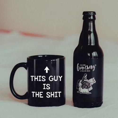 Vista 3 de FALJIOK Taza de café divertida con texto en inglés "This Guy Is the Shi*", regalo novedoso para papá, marido, hijo, hermano, novio, compañero