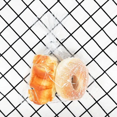 Vista 4 de 100 bolsas de celofán de 8 x 10 pulgadas, bolsas transparentes para golosinas con lazos giratorios de 4 pulgadas, bolsas de plástico