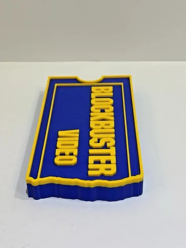 Vista 2 de 3D Impreso Blockbuster Video Logo Signo Retro 90s Sala de Películas Decoración Exhibición