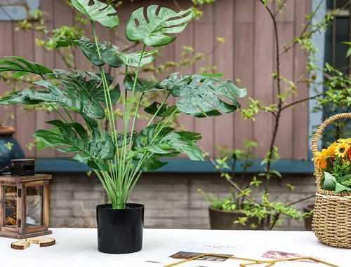Vista 4 de Toopify Plantas falsas de 28 pulgadas, Monstera artificial en maceta negra Café