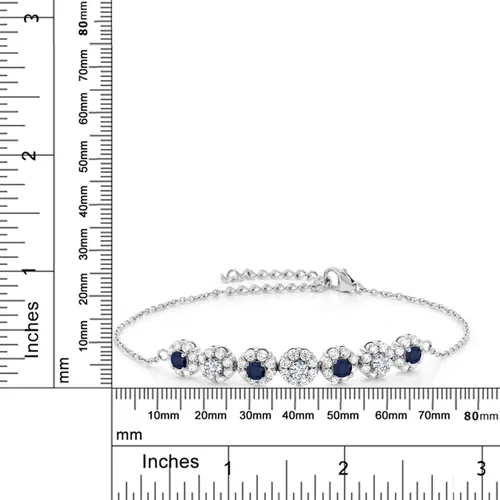 Vista 2 de Gem Stone King Pulsera de tenis de plata de ley 925 con moissanita blanca y circonita blanca de zafiro azul para mujer