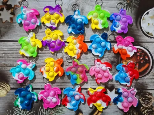 Vista 2 de 20 piezas de mini tortuga arcoíris Pop Fidget llavero juguete, regalos de fiesta, juguetes de burbujas para aliviar la ansiedad y el estrés, regalo