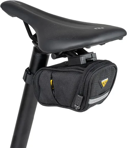 Vista 2 de Topeak Aero Wedge Pack DX Small – Bolsa expandible debajo del sillín de 0,5 L con soporte QuickClick F25, tira reflectante y bolsillos laterales