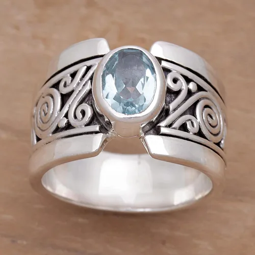 Vista 2 de NOVICA Anillo artesanal hecho a mano con topacio azul de una sola piedra de ley .925 ancho con piedra natal de serenidad de Indonesia 'Blue Karma