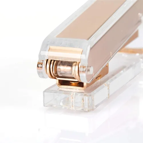 Vista 3 de Elegante grapadora de acrílico ultra transparente para suministros de oficina, grapadora de escritorio dorada mate con 1000 grapas para accesorios