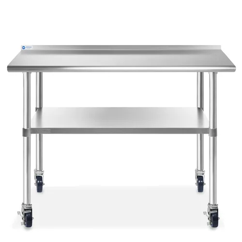 Vista 2 de Gridmann. Mesa de preparación y trabajo para cocina comercial, hecha en acero inoxidable con 4 ruedas con protectores contra salpicaduras. Varios