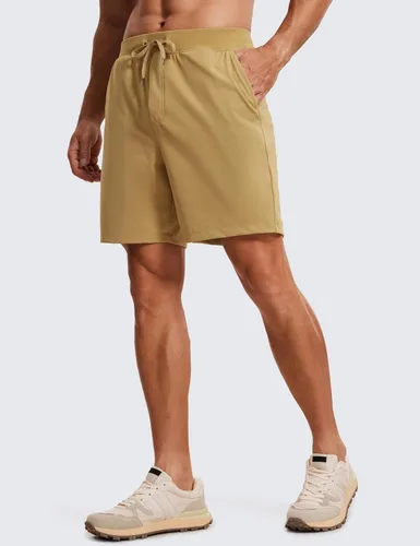 Vista 2 de CRZ YOGA Pantalones cortos de entrenamiento elásticos en cuatro direcciones para hombre, 7 pulgadas, suaves, duraderos, casuales, con bolsillos