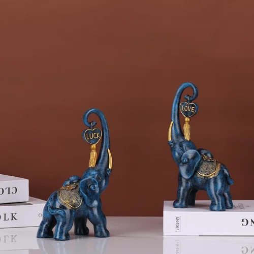 Vista 4 de DOVDOV Juego de 2 piezas de estatua de elefante azul, escultura de elefante de amor, elefante azul para decoración del hogar, estantería de oficina