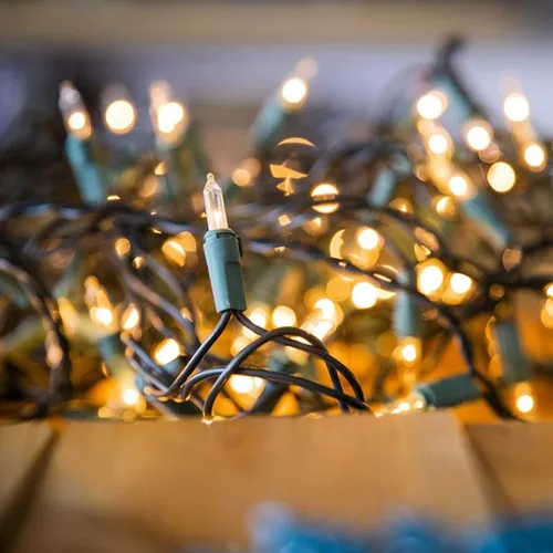Vista 5 de FUNPENY Luces de Navidad, 30 pies 150 luces incandescentes, minicadena de luces transparentes, blanco cálido con cable verde para árbol de Navidad