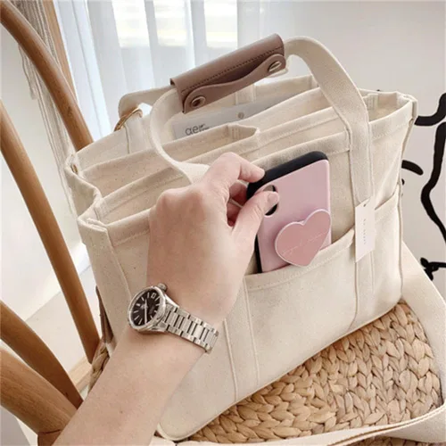 Vista 3 de Bolsa de lona con múltiples bolsillos para mujer, bolsa cruzada duradera de gran capacidad, bolsa de hombro práctica casual con compartimentos