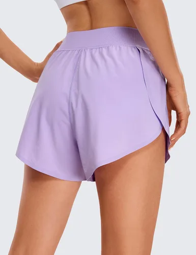 Vista 2 de CRZ YOGA Pantalones cortos deportivos de cintura media Dolphin para mujer, ligeros, con abertura alta, para gimnasio, entrenamiento, con forro