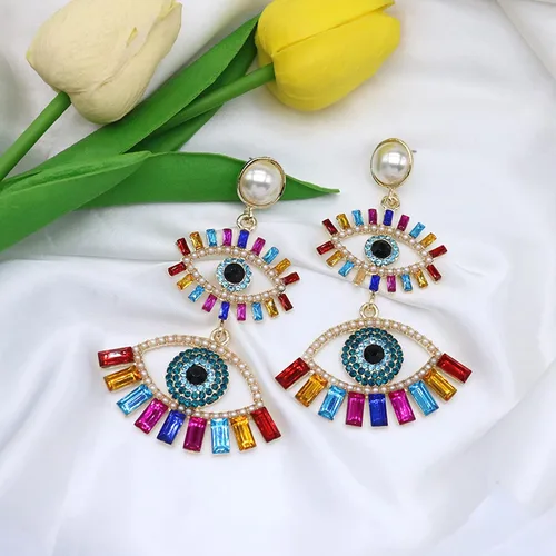 Vista 7 de Aretes colgantes de cristal para mujer, diseño de ojos malvados y divertidos, con diamantes de imitación abstractos y ojos colgantes, joyería