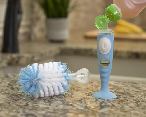 Vista 3 de Nuby Cepillo para botella de cerdas suaves y duraderas con asas texturizadas y base de succión, sistema 2 en 1, color azul