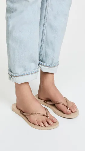 Vista 3 de Havaianas - Sandalia delgadas con diseño de la Mujer Maravilla para mujer, Oro Rosa