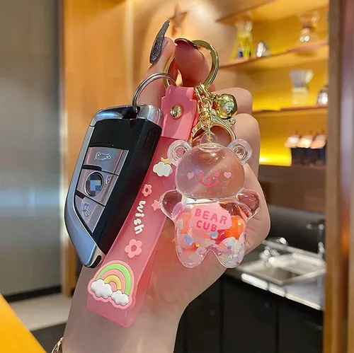 Vista 4 de Llavero Kawaii con diseño de oso líquido flotante de arena movediza, lindo llavero, bolsa, pulsera con dije para mujeres y niñas