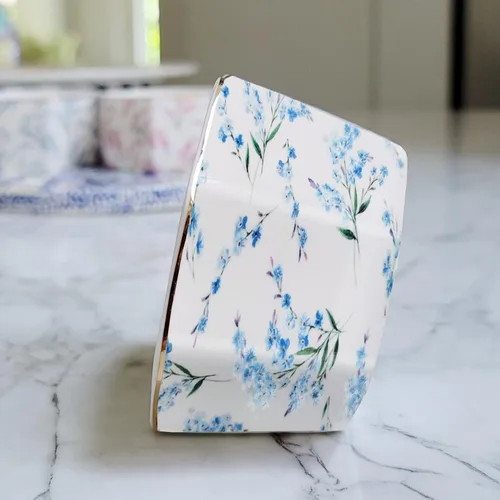 Vista 2 de Soporte de clip de papel de cerámica con línea dorada, dispensador de clips de papel geométrico floral para escritorio, lindo organizador de clips