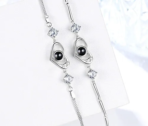 Vista 3 de KnSam - Pulsera de 100 idiomas con corazón de plata para mujer