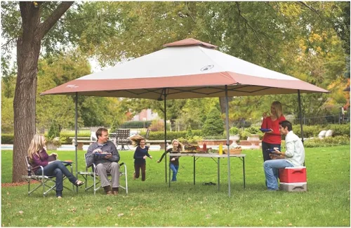 Vista 6 de Coleman 13x13ft Instant Canopy Sun Shelter Portable Shade Tent Sets Up in 3 Minutes Vented Roof for Airflow Great for Campsite Backyard Tailgates