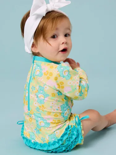 Vista 6 de RuffleButts - Traje de baño de una pieza con protección solar UPF 50+, camiseta de protección floral estampado, manga larga, con cierre zipper