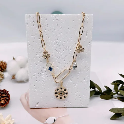 Vista 5 de Collar de cadena de clip de papel con encanto de estilo boho chapado en oro para mujer, hecho a mano, con ojo malvado, sol, luna, estrella, flor