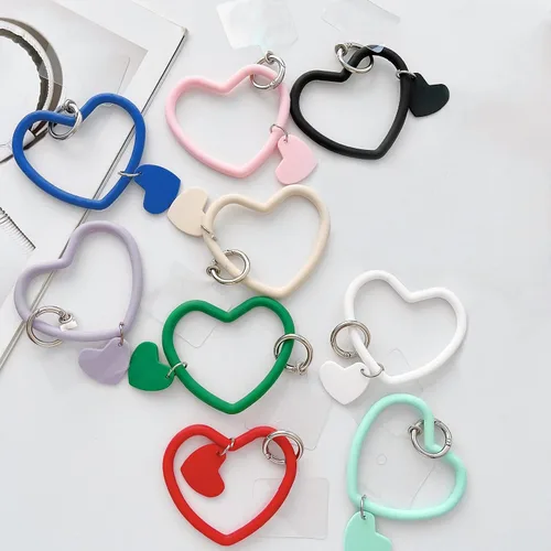Vista 7 de Correa de silicona con forma de corazón para teléfono, correa de muñeca para teléfono celular con soporte para llaves, universal compatible
