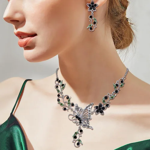 Vista 4 de EleQueen Conjunto de collar y pendientes de mariposa, flor y hoja de cristal austriaco para mujer Negro