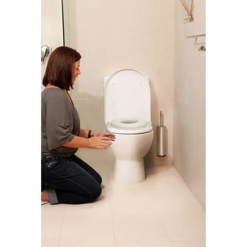 Vista 6 de Dreambaby Asiento de inodoro para orinal, acolchado suave con asas de agarre, color blanco, modelo L674