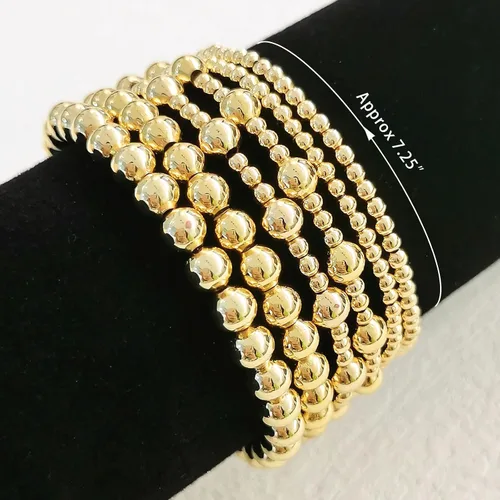 Vista 5 de Pulseras de oro para mujer, chapado en oro de 14 quilates, apilables, juego de pulseras elásticas de cuentas de oro, joyería de oro para mujer