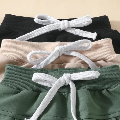 Vista 7 de Paquete de 3 pantalones deportivos para bebés y niños pequeños, pantalones deportivos sólidos de meter, pantalones deportivos para otoño, ropa