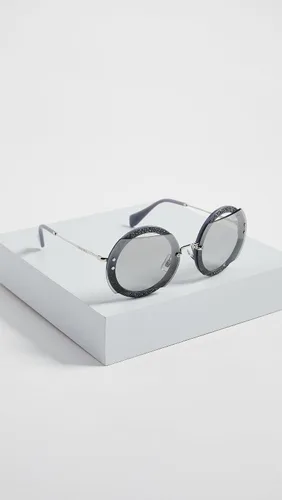 Vista 4 de Miu Miu MU 06SS C8O1A0 - Lentes de sol redondos de plástico gris