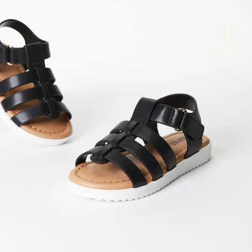 Vista 5 de FabKids Sandalias de gladiador para niñas, sandalias planas de tiras trenzadas, sandalias de verano con punta abierta, zapatos de vestir