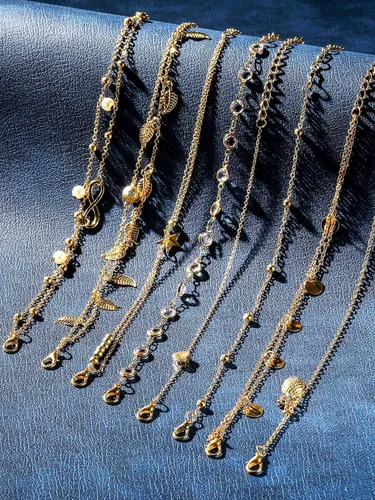 Vista 4 de Hicarer Tobilleras de 16 piezas de 14 quilates para mujeres y niñas, juego de tobilleras de plata y oro para niñas, tobilleras de playa bohemias