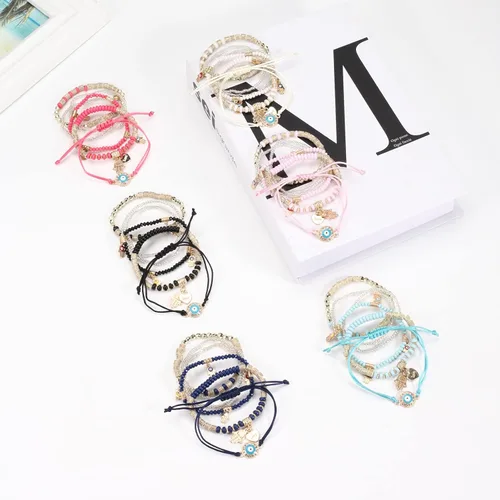 Vista 3 de Budsmile Pulseras bohemias de cuentas elásticas para mujeres y niñas, juego de pulseras apilables en múltiples capas, dijes multicolor hechos a