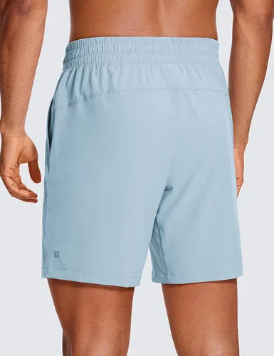 Vista 2 de CRZ YOGA Pantalones cortos de entrenamiento sin forro para hombre, 7 pulgadas, secado rápido, para correr, deportes, gimnasio, con bolsillos