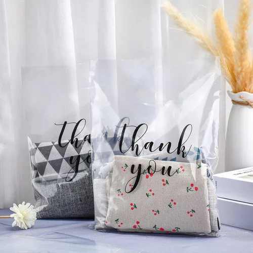 Vista 4 de Crtiin 100 piezas de bolsas de mercancía transparentes con texto "Thank You" y asas troqueladas para compras, bolsas de plástico para embalaje
