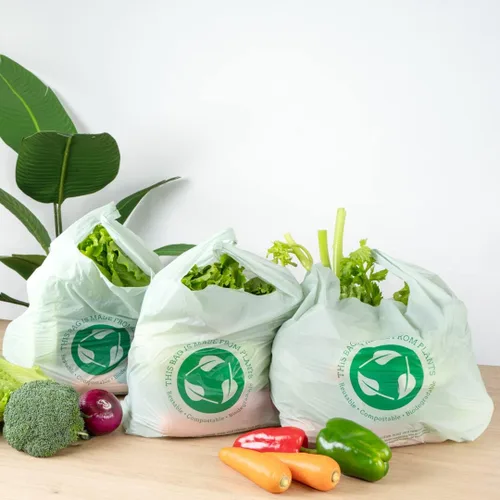 Vista 7 de Restaurantware -Bolsas de comestibles de tamaño 1/6, 100 bolsas de plástico duraderas - Asas de camiseta, bolsa de compras de plástico verde de alta