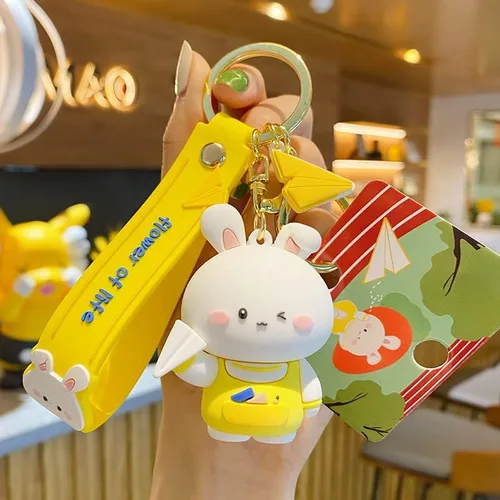 Vista 2 de BEXOA Lindo llavero de regalo de Navidad Llavero de conejo Kawaii de Año Nuevo para niños y niñas, mochila con dijes para mujeres y hombres