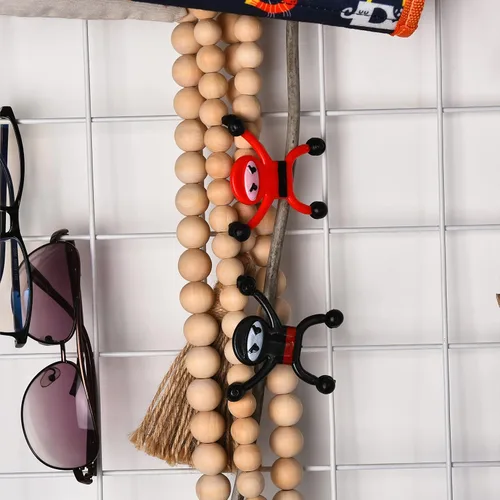 Vista 5 de Neliblu Juguetes pegajosos Ninja para escalar pared y ventana, 12 unidades que lanzas a la pared, juguetes de mano para recuerdos de fiesta, regalos