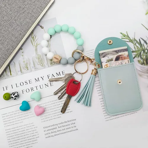 Vista 3 de FIVWIN Llavero de pulsera para mujer, pulsera de silicona con cuentas de automóvil, llavero con borla, tarjetero