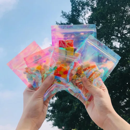 Vista 2 de Bolsa de embalaje resellable holográfica rosa transparente con cremallera para almacenamiento de alimentos, brillo de labios, pestañas, joyas