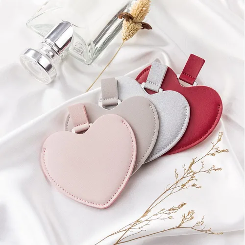 Vista 2 de Espejo compacto de acero inoxidable, espejo de bolsillo inastillable en forma de corazón con funda de piel sintética, mini espejo irrompible