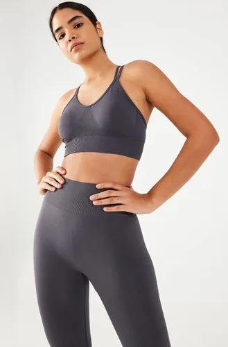 Vista 5 de COMEUP Sujetador deportivo sin costuras con tiras para mujer, almohadillas extraíbles en el pecho. Sujetador deportivo de soporte medio