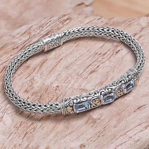 Vista 4 de NOVICA Pulsera trenzada artesanal de topacio azul con acento dorado y color vermeil de Bali Indonesia 1.8 pulgadas de largo x 0.3 pulgadas de ancho