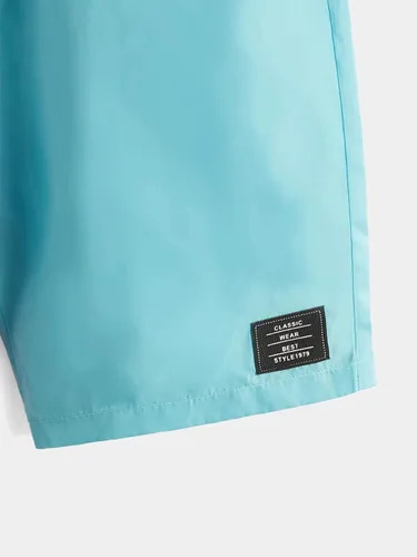 Vista 4 de OYOANGLE Pantalones cortos de pierna recta con cordón en la cintura y bolsillos para niño