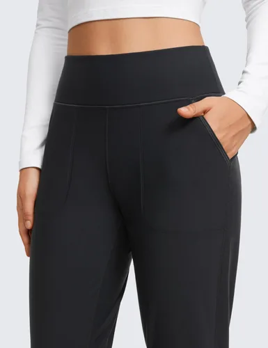 Vista 5 de CRZ YOGA Pantalones deportivos de entrenamiento con forro polar para mujer con bolsillos de 27.5 pulgadas, pantalones de senderismo y correr al aire