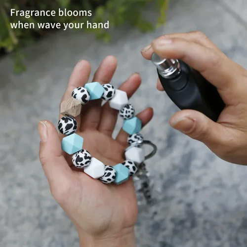Vista 5 de Pulsera de silicona con cuentas de vaca, llavero de cuero con borlas de coche, llavero para mujer