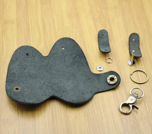 Vista 7 de Mejora la seguridad para evitar que se caiga de cuero genuino para llaves de puerta de coche, protector de llaves