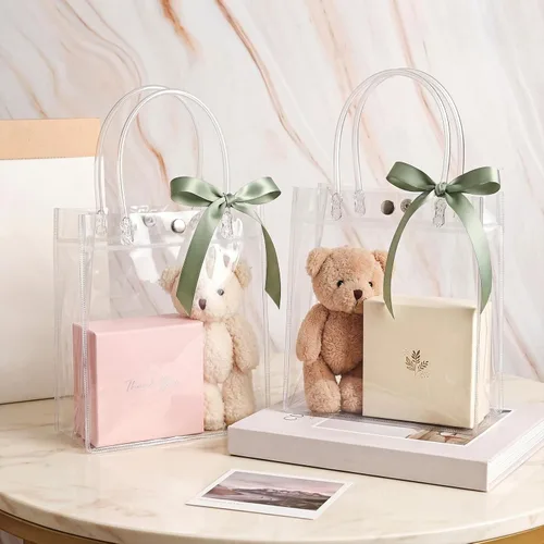 Vista 3 de Saintrygo 50 bolsas de regalo de plástico transparente con asas, bolsas de regalo de plástico reutilizables de PVC, bolsa de regalo de plástico
